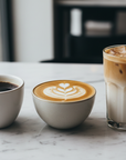 make an image of three coffee cups. the first one with black coffee. the second one with a latte and the third one with an iced cappiccino 